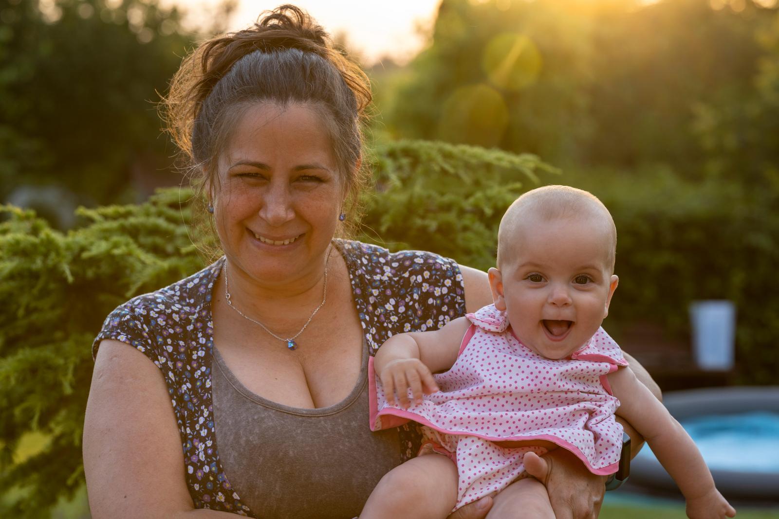 Mother and baby at sunset