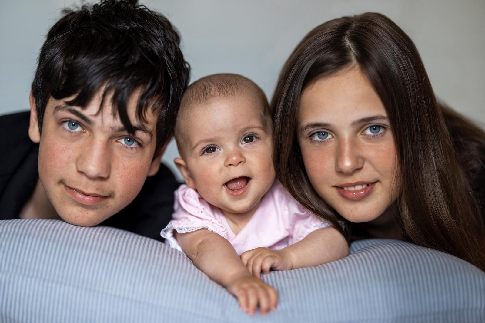 Siblings with baby