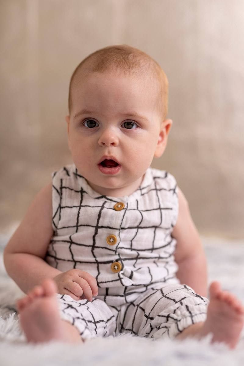 Baby in grid romper