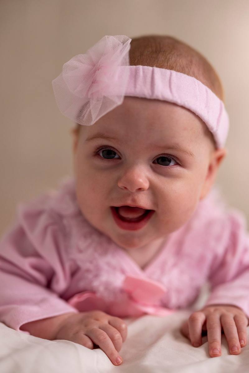 Baby with pink bow