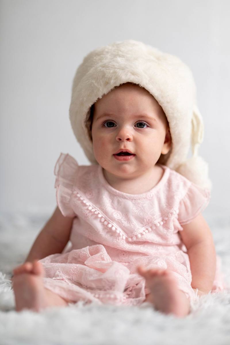 Baby with pink hat